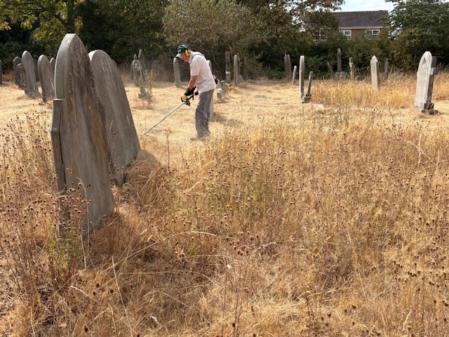 A further view of the strimming work in the churchyard.