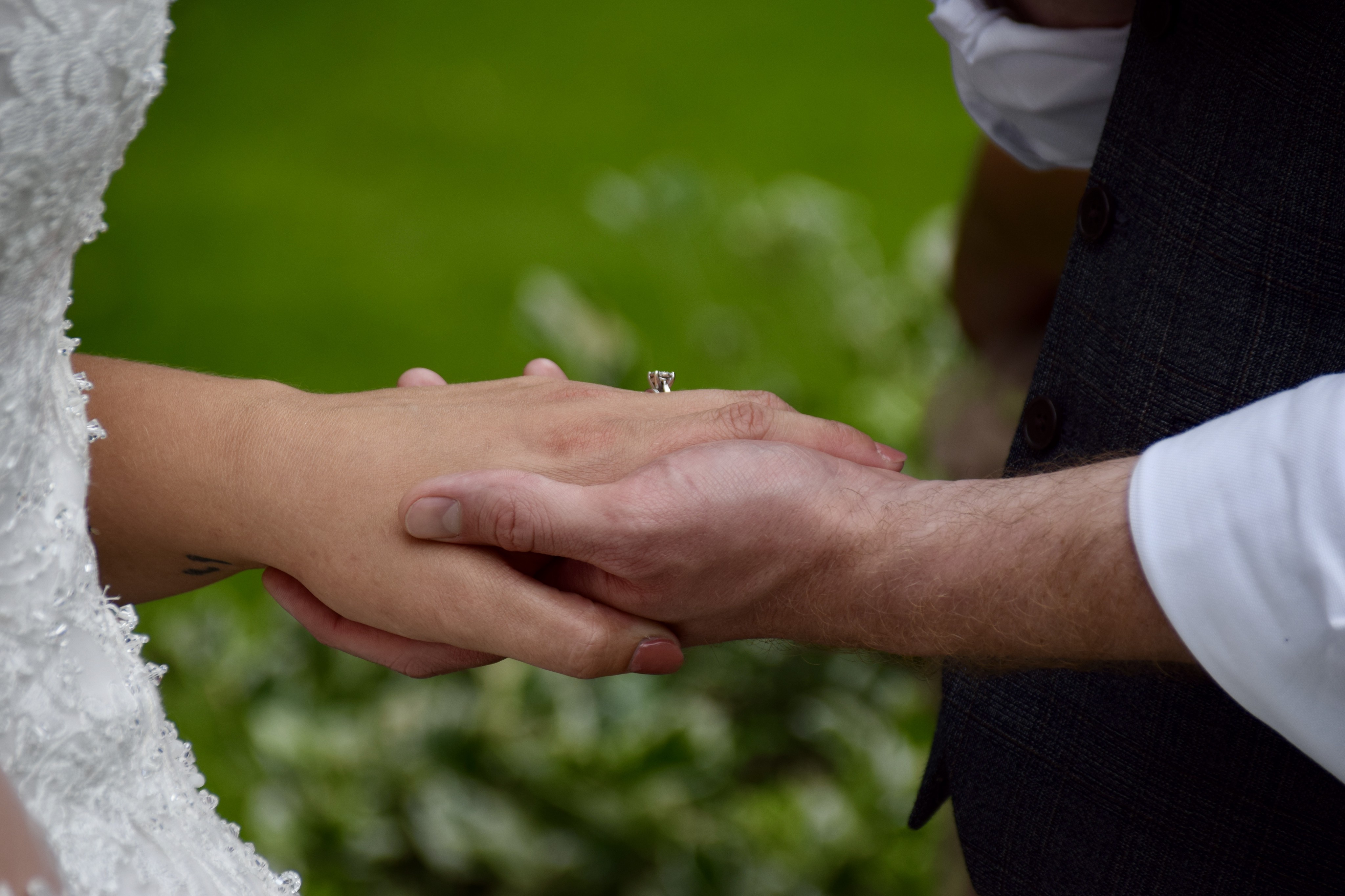 A bride and groom holding hands during their wedding at Holy Trinity, Finningley