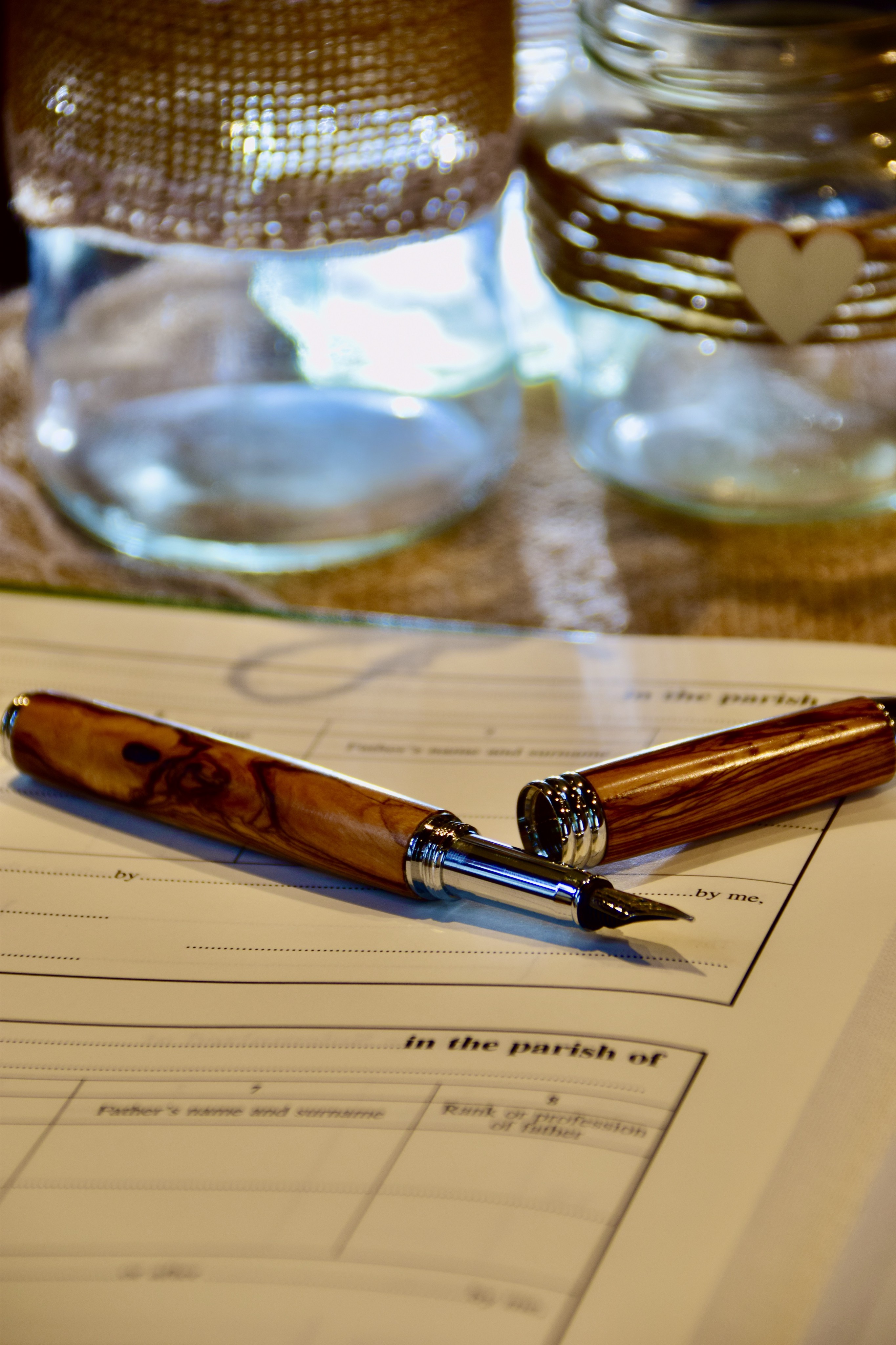 A fountain pen resting on the marriage register, ready for signing